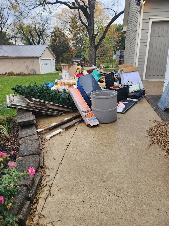 Dumpster being loaded with debris for 30 Yard Dumpster Rental in Strathmore